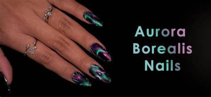 Aurora borealis inspired nails with shifting green, purple, and blue iridescent shimmer
