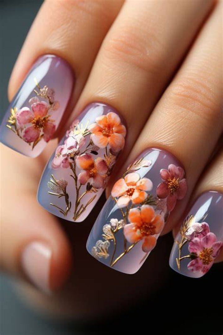 Botanical floral nail art with delicate painted flowers and leaves