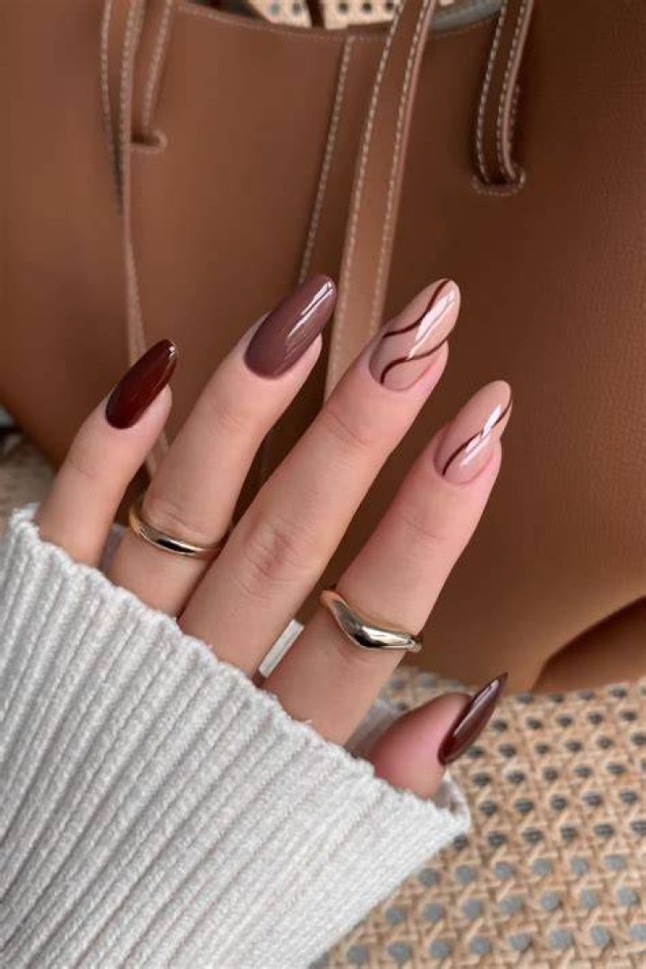 Rich chocolate brown and caramel nail aesthetic 2026