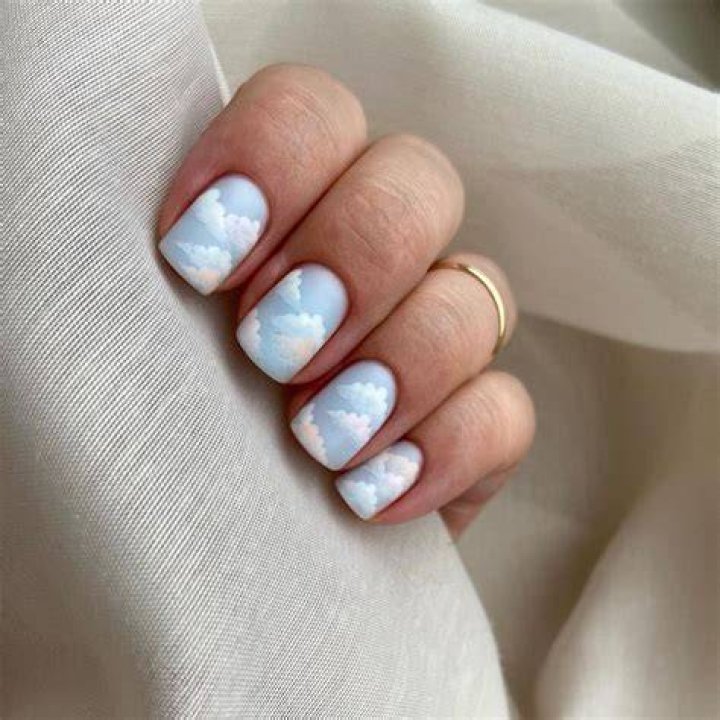 Dreamy cloud and sky nail art with soft blue and white cotton clouds