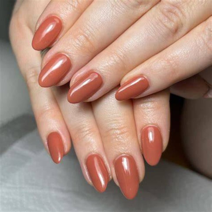 Glazed terracotta and warm earth tone nail designs trending in 2026