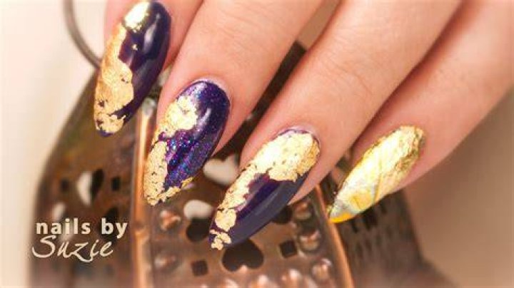 Luxury marble nail art with gold foil veining 2026