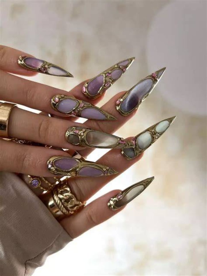 Metallic foil statement nail art editorial look 2026